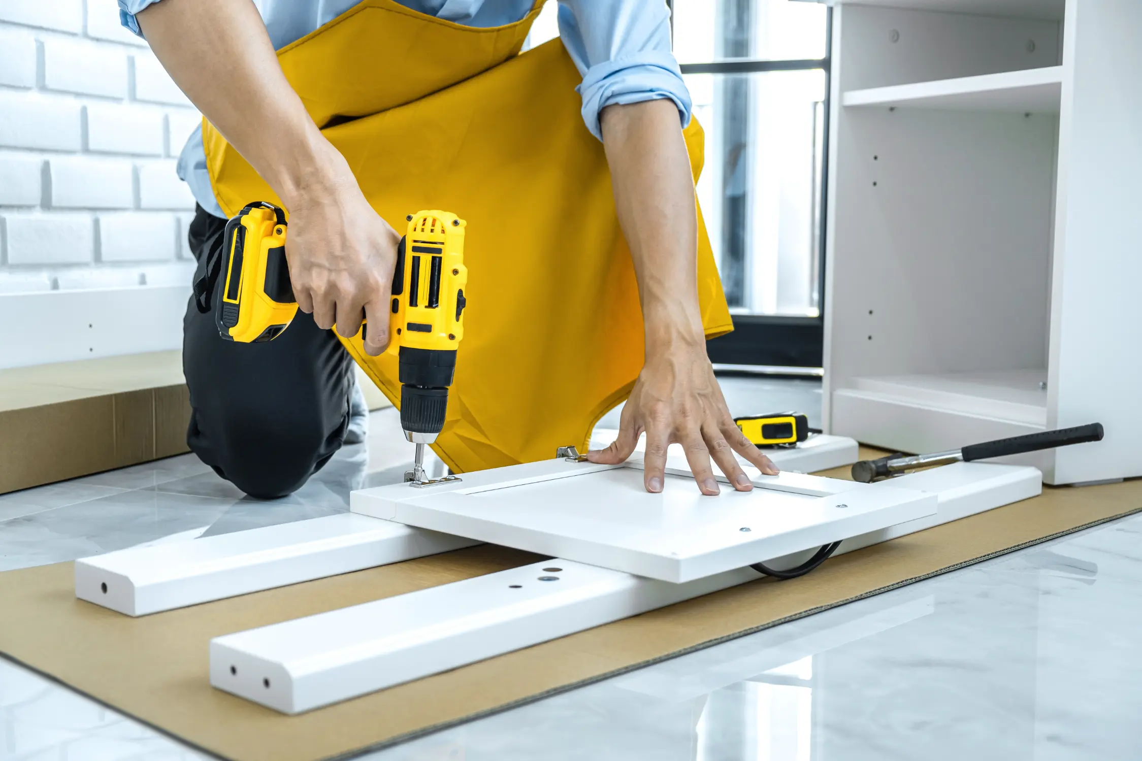 Technician assembling furniture